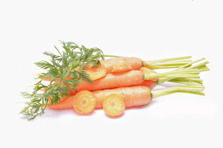 fresh carrots isolated on white backgroundの写真素材