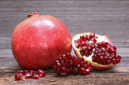 Pomegranate on wooden tableの写真素材