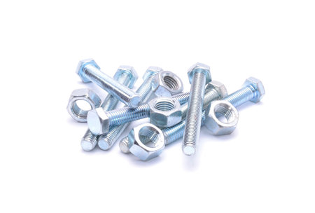 Steel bolt and screw nuts isolated on white backgroundの写真素材