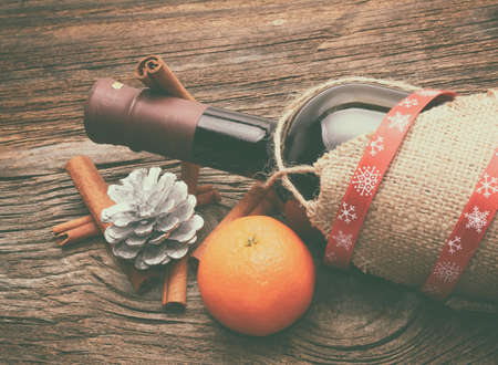 Red wine, bottle and christmas ornamentsの写真素材