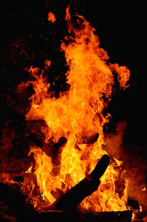 hot fire in darkness on fireplaceの写真素材