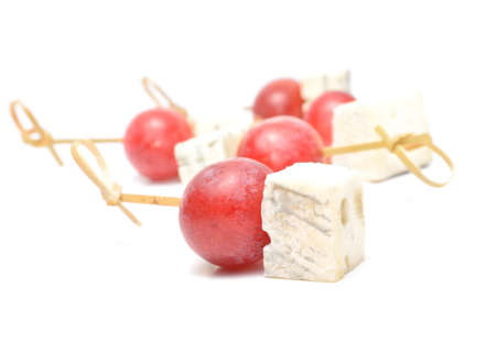 pieces of blue cheese and red grapesの写真素材