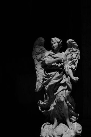 Sculpture of an angel in black and whiteの写真素材