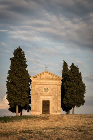 Chapel of the Madonna at sunset with clouds in front viewの写真素材