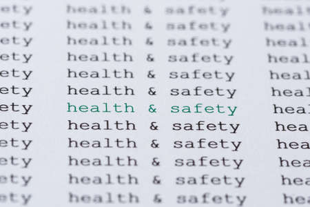 The phrase health  safety highlighted in green amongst similar black textの写真素材