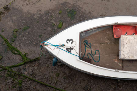 Seaton Sluice Northumberland UK 26 June 2101. Fishing boat in harbour or harbor at low tide.の写真素材