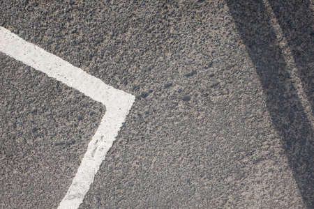 Abstract white line road markings on tarmac road or car parkの写真素材