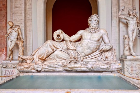 River god Arno sculpture front view with fountain basin in foreground. The Vatican museum, Rome, Italyのeditorial素材