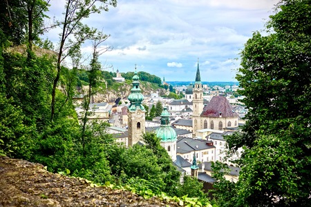 Aerial view of Salzburg, Austria under a cloudy blue skyの写真素材