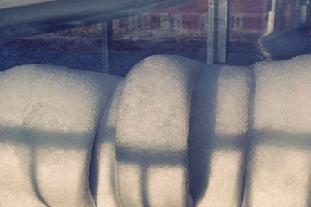 Close-up of rolled like ice piled up on the edge of an ice rink