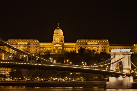 The Hungarian landmarks Chain Bridge, Royal Palace and Danube river in Budapest at night.のeditorial素材