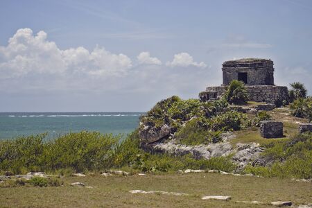Mayan stone ruins with ocean in Tulum Mexico.の写真素材