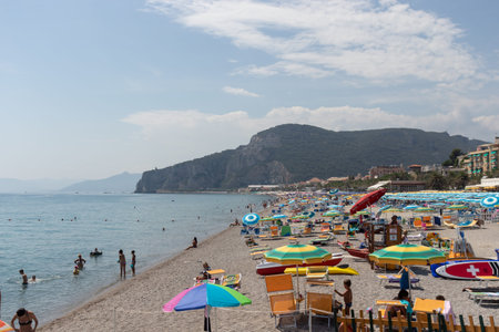 Italy, Finale August 2020: Buys beach with a lot of people spending their holiday in Finale Liguria during covid19.のeditorial素材