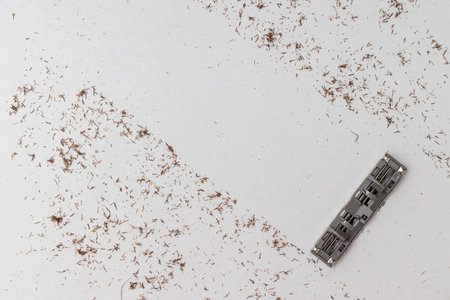 Cut off hair from shaving against white background with razor blade. Concept shaving or removing hair.の写真素材
