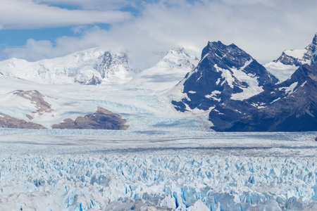 Perito Moreno seen close up with mountain landcape background in argentina