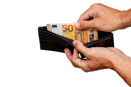 50 euro bill sticking out of black wallet hand holding money bill.