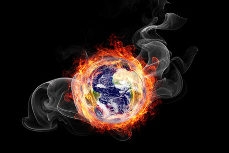 Earth burning in flames concept of global warming and catastrophe.の写真素材