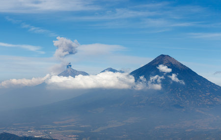 Volcanos agua acatenango and fuego in guatemala during a sunny day seen from pacaya.の写真素材