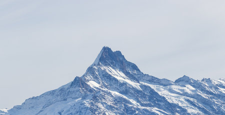 Mountain schreckhorn seen in the distance in switzerland.の写真素材