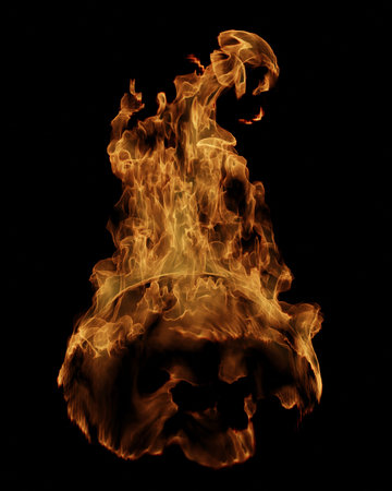 Vibrant flames rising high in darknessの写真素材