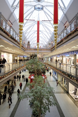 Istanbul, Turkey - January 3, 2011: Interior of a shopping mall during Christmas. Lots of people walking around going to stores, buying things and consuming food and beverages.のeditorial素材