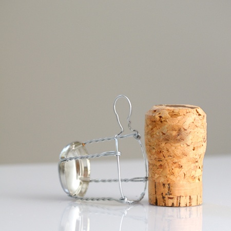 Champagne cork isolated on gray background. Useful file for your advertising about celebration, beverage industry, etc.の写真素材