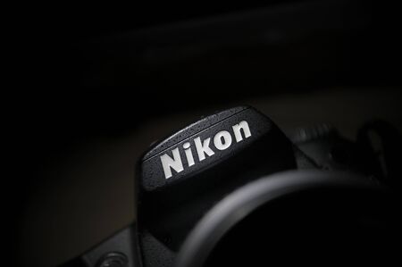 Paris, France - February 11, 2012: Nikon logo on a DSLR body. Nikon Corporation - the multinational corporation headquartered in Tokyo, Japan announces a new 36.3 megapixel FX-format professional D-SLR, the Nikon D800. This new camera delivers unprecedentのeditorial素材