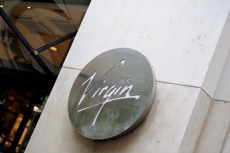 PARIS - JULY 13: Vrgin Mega store sign on Champs-ÃlysÃ©es boulevard in Paris in  July 13, 2012. The brand Virgin Records is a British record label founded by English entrepreneur Richard Branson, Simon Draper, and Nik Powell in 1972.のeditorial素材