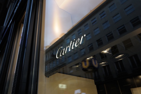 VIENNA - JULY 4: Detail of Cartier corporate logo of the French luxury jeweler and watch manufacturer shop located in Vienna. Cartier S.A., is a French luxury jeweler and watch manufacturer headquartered in Paris, France.のeditorial素材