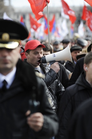 Protester with megaphone. One of the 10 thousand people who gather in the National Square to protest against the current administration and president elections. Chisinau, Republic of Moldova. 16th march 2012のeditorial素材