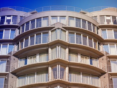 Modern, large apartment building on sunset  Useful file for your construction project, flyer, brochure and other needs のeditorial素材