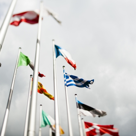 National flags of various European countries with Greek flag in the centre, in front of the official seat of the European Parliamentのeditorial素材
