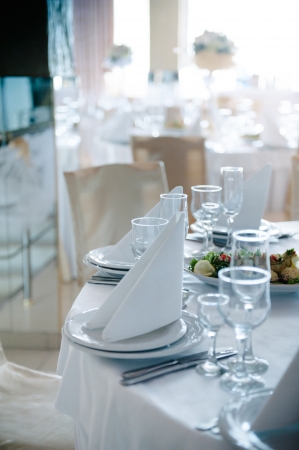 Detailed place setting at wedding reception in calm blue tone castの写真素材