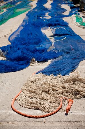 Fishing nets and rope  blue and green nylon  in port  Selective focus on foregroundの写真素材