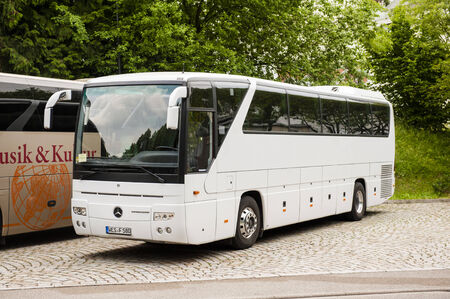 BADEN-BADEN, GERMANY - MAY 31, 2012: White Mercedes-Benz Tourismo coach bus parked in tourist sightseeing place in Baden, Germany on May 31, 2012. のeditorial素材