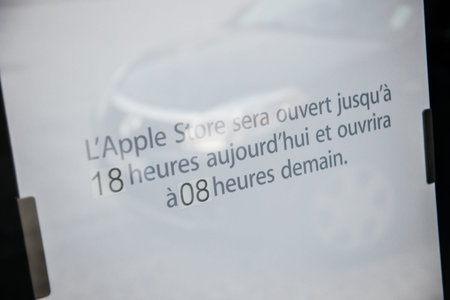 STRASBOURG, FRANCE - SEPTEMBER 18, 2014: Apple Store with covered front shopping-windows and unusual...