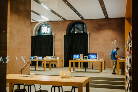 STRASBOURG, FRANCE - SEPTEMBER 18, 2014: Apple Store with working Apple Genius Employee and covered...