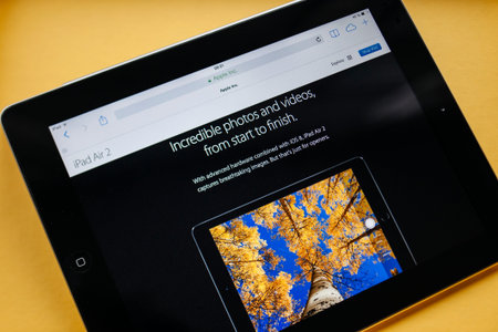 PARIS, FRANCE - 17 OCTOBER 2014: Photo of Apple iPad tablet with apple.com webpage of the new iPad...