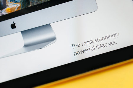 PARIS, FRANCE - 17 OCTOBER 2014: Photo of Apple iPad tablet with apple.com webpage of the new iMac...