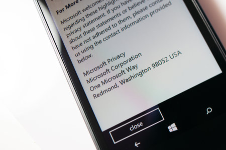 LONDON, UNITED KINGDOM - NOVEMBER 9, 2014: Nokia Lumia smartphone windowsphone displaying Microsoft Privacy address on phone display. Microsoft has announced that it will stop using Nokia branding on all future mobile phonesのeditorial素材