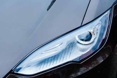 PARIS, FRANCE - NOVEMBER 29:  The Tesla Motors Inc. frontal view advanced xenon head-lights of the Model S electric vehicle displayed at the companyのeditorial素材