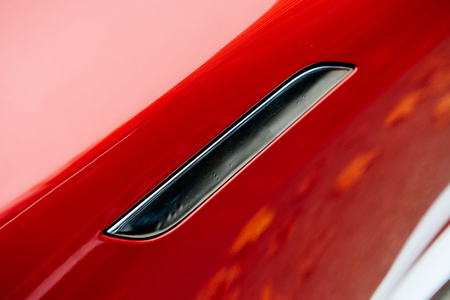 PARIS, FRANCE - NOVEMBER 29: Tesla Motors model S sedan innovative electric car door handle. Tesla is an American company that designs, manufactures, and sells electric carsのeditorial素材
