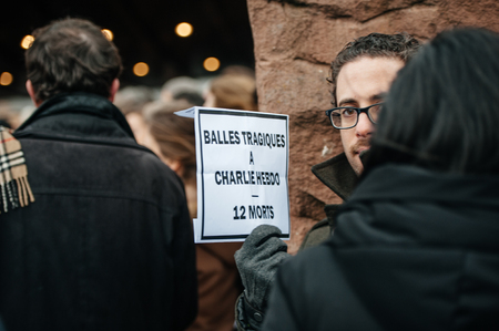 STRASBOURG, FRANCE - JANUARY 09, 2015: Council of Europe employees and Thorbjorn Jagland - Secretary General of the CE attend to a silent vigil to condemn the gun attack at French satirical magazine Charlie Hebdo office in Paris, which killed 12 people onのeditorial素材