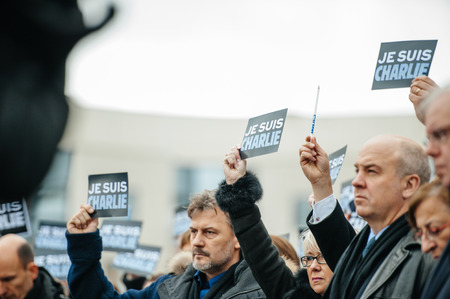 STRASBOURG, FRANCE - JANUARY 09, 2015: Council of Europe employees and Thorbjorn Jagland - Secretary General of the CE attend to a silent vigil to condemn the gun attack at French satirical magazine Charlie Hebdo office in Paris, which killed 12 people onのeditorial素材