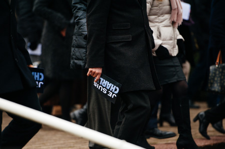 STRASBOURG, FRANCE - JANUARY 09, 2015: Man holding Je Suis Charlie poster after attending a silent vigil to condemn the gun attack at French satirical magazine Charlie Hebdo office in Paris, which killed 12 people on January 7, 2015のeditorial素材