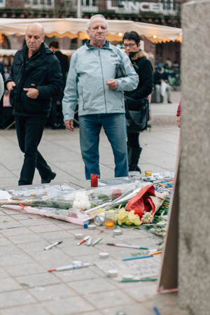 STRASBOURG, FRANCE - 10 JAN, 2015: Light candles and pencils near General Kleber statue in tribute to the victims of the terrorist attacks in Paris on January 11, 2015のeditorial素材