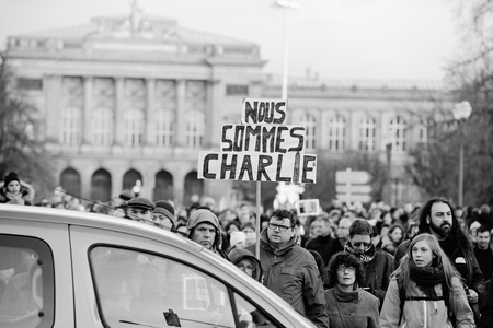 STRASBOURG, FRANCE - 11 JAN, 2015:  People hold placards reading 'Je suis Charlie' during a unity rally (Marche Republicaine) where some 50000 people took part in tribute three-day killing spree in Parisのeditorial素材
