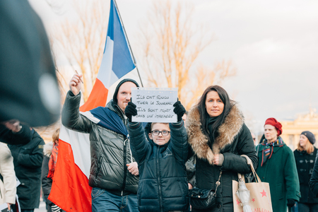 STRASBOURG, FRANCE - 11 JAN, 2015:  People hold placards reading They wanated to kill a magazine, they are killed in a typography' during a unity rally (Marche Republicaine) where some 50000 people took part in tribute three-day killing spree in Parisのeditorial素材