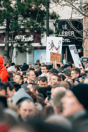 STRASBOURG, FRANCE - 11 JAN, 2015:  People hold placards reading 'Je suis Charlie' during a unity rally (Marche Republicaine) where some 50000 people took part in tribute three-day killing spree in Parisのeditorial素材