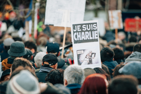 STRASBOURG, FRANCE - 11 JAN, 2015:  People hold placards reading 'Je suis Charlie' during a unity rally (Marche Republicaine) where some 50000 people took part in tribute three-day killing spree in Parisのeditorial素材